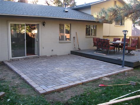 Diy patio pavers. Lay one the first spacer down, and use a squaring tool to lay down a crossing spacer. Then go ahead and carefully place your first concrete paver against the two spacers. Repeat using the spacers to lay more pavers. Remember, you can walk on these as you lay them. Step 8. 