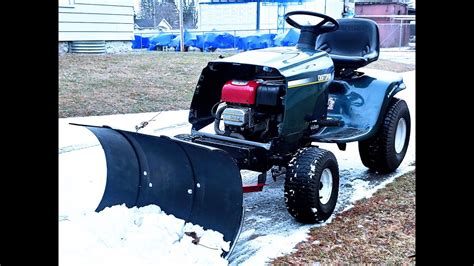 Diy tractor snow plow. Quick & Easy snow plow built from pieces of old materials that I had sitting around for my Craftsman LT1000 Lawn Tractor. Built for free using a old metal si... 