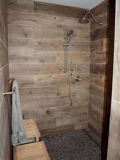 Diy walk in shower. Evenly Space Tiles. Continue installing tile in horizontal rows, placing spacers of choice in between tiles. Once the thinset dries (at least 12 hours), remove the temporary wood board, and install tile on the bottom row. Let dry for 24 hours, and … 