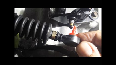 Describing a slightly different way to replace the transmission cable bushing without removing all the battery tray components.. 