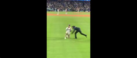 Dodgers fan runs onto field to propose, gets pummeled by security