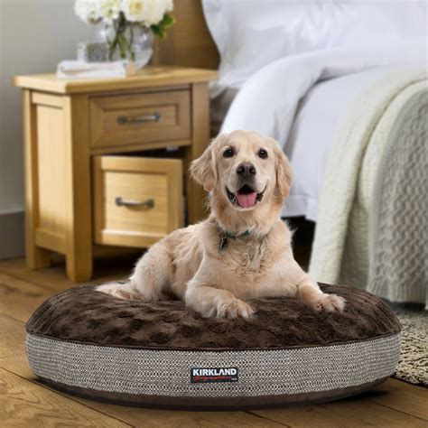 Dog bed costco. L-shaped beds consist of rectangular mattresses with two bolsters or sides that join to form an L. Kirkland’s Medium Bolster Bed measures 28″ x 36″ and features a foam foundation and memory foam topper. Included in the color options are navy plaid and brown embossed. This kind of dog bed will cost you around $60. 