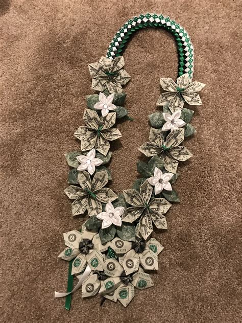 Dollar bill flower lei. May 30, 2020 · The lei with money leaves is an interesting craft for Graduation. We need 24 dollar bills, lei out of ribbons, a thread, a needle, scissors. How to make the ... 