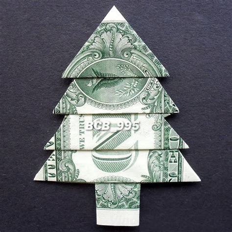 A simple step-by-step tutorial on how to fold a dollar bill into a tree. It works great as a Christmas tree and folded from a large bill would make a perfect...