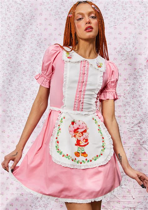 Dolls Kill X Strawberry Shortcake Extra Serving Picnic Blanket cuz cake is best shared among friends. This blanket has a quilted construction, a patchwork design, a strawberry print ruffled trim, and comes with a storage bag with an adjustable nylon strap. PINK; 100% Polyester; 58" x 58". 