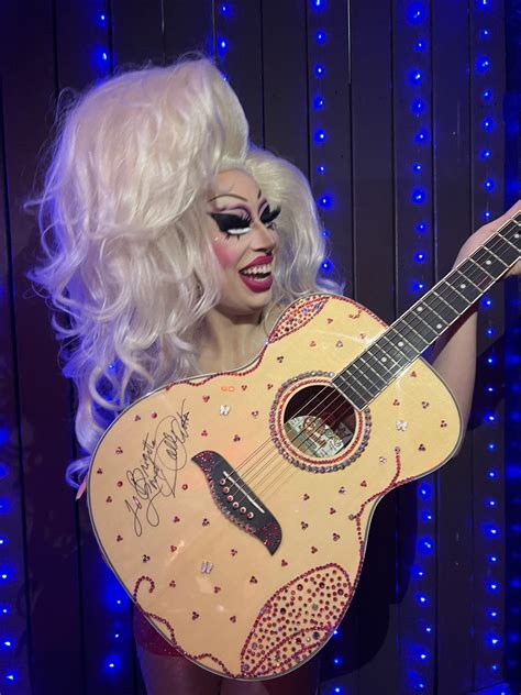 Dolly Parton sends signed, bejeweled guitar to Austin drag performer Brigitte Bandit