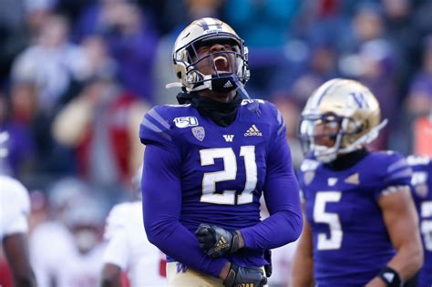 Washington running back Dillon Johnson reacts after scoring a touchdown against Oregon during the first half of an NCAA college football game, Saturday, Oct. 14, 2023, in Seattle.