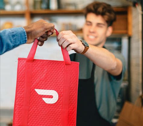 DoorDash orders surge 24% in the third quarter, helping to narrow the delivery app’s losses