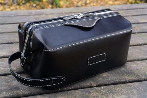 Dopp kit leather. The perfect addition to your travel bag. Store your toiletries and/or other small items inside our handcrafted Dopp kit. water resistant interior handcrafted from vegetable tanned goat leather side carry handle zip closure front zipper pocket 