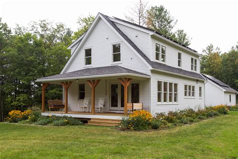 Marg and Liz have a ton of stylish designs that you can check out at their blog Fancy Farmhouse. Note worthy farmhouse exterior design elements are: Dark Roof. White Plank Siding. White Windows & Trim. Black Shutters. Brown Stone Chimney. Covered Front Porch.