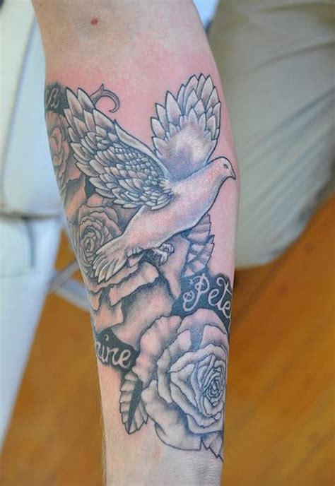Experience pure tranquility with this serene Black&amp;Grey tattoo design. This stunning piece encompasses a gracefully soaring dove, mirroring peace and freedom. Surrounded by intricate floral patterns in soft whites, the bird's wings add a touch of ethereal beauty. A perfect embodiment of raw, emotive art for your sk. 