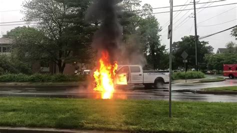 Downed power line lands on car in Newton, sparking fire