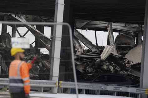 Dozens of flights are canceled after a fire rips through a parking garage at London’s Luton Airport