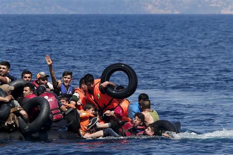 Dozens of migrants rescued off Greek island of Lesbos. Search is under way for woman feared missing