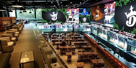 Draftkings sportsbook wrigley. Sports gambling giant DraftKings today unveiled the new 17,000-plus-square-foot addition to the southeast corner of the Friendly Confines, dubbed the DraftKings Sportsbook at Wrigley Field. 