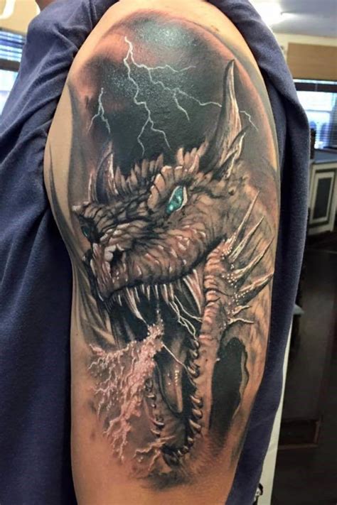 Dragon head tattoo. The dragon head tattoo is a popular dragon tattoo idea for women and for men as well. It might be just one part of the dragon’s body but this is surely one eye-catching design. The detail of the eyes and the face brings power to this tattoo. @ll3.tattoo.. 
