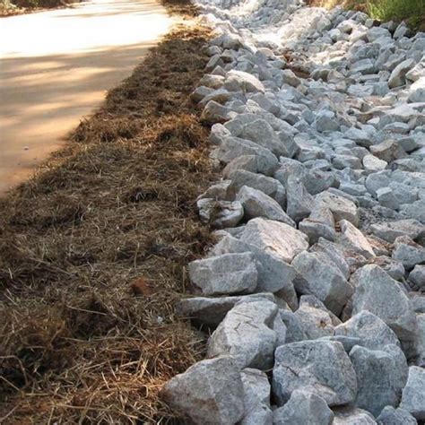 Drainage rock. Washed round rock ranging from the size of 1 ½” to 7/8”. Most typically used for drainage. Not well-suited for driveway material. Residential projects. Uses: Works well in curtain drains and won't clog holes for perforated piping. Can also be used as ground cover in landscaping applications. Used most commonly for DEC septic systems and ... 