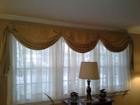 Drapes for large windows. ... curtain panels. More photos ... If your sunroom or other living space is lined with walls of large windows ... Drapery panels hung high and wide are also a good fit ... 
