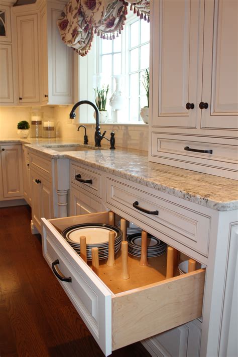 Drawer Pegs make storing plates easy! Designed by AKB Favorite Kitchen