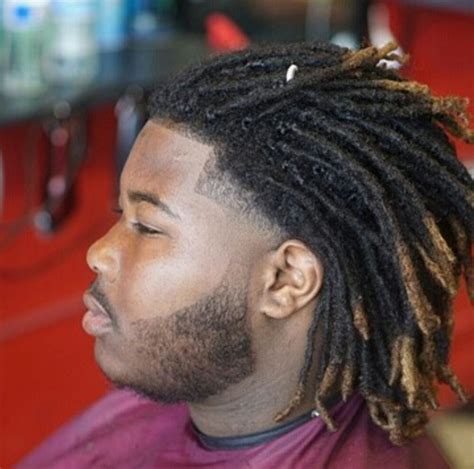 6. Short Afro Waves with Skin Taper. Source. Skin tapers pair best with short afros, and for a little extra style, you could try to form waves in your hair as he has done in the photo above. This is a classic and simple hairstyle that would look great on men with any type of hair. 7.. 