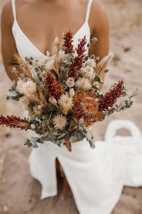 Dried flower bridal bouquet. As the bride's ultimate floral accessory, the wedding bouquet is the finishing touch on your big day look and should be chosen carefully. While we love a voluminous clutch of cascading You've finally decided on the dress and shoes, now it's time to start thinking about the flowers that you'll be carrying down the aisle. 