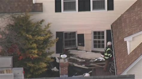 Driver arrested, charged with OUI after allegedly striking two homes in Hopkinton