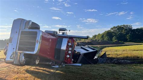 Driver freed after tractor-trailer overturns into cranberry bog in Plympton