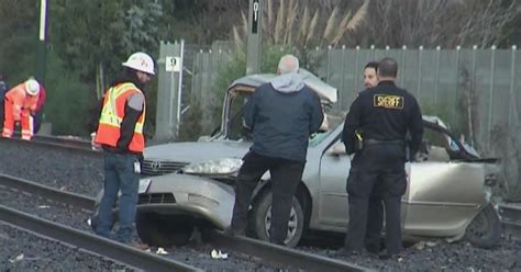 Driver hospitalized after vehicle was hit by Caltrain in Burlingame