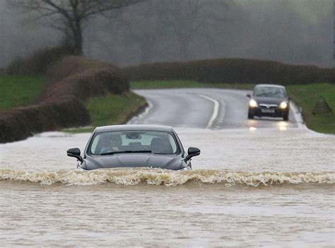 Drivers caught on camera traveling through flood waters