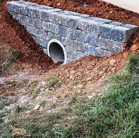 Driveway culvert wall ideas. This retaining wall is for when you need to extend your driveway. This is for when you want to make it longer or more approachable. With this sort of design, we always suggest including a curb or parking stop at least four feet out from the retaining wall. This will ensure there's no potential for a driver to accidentally clip or run into the ... 