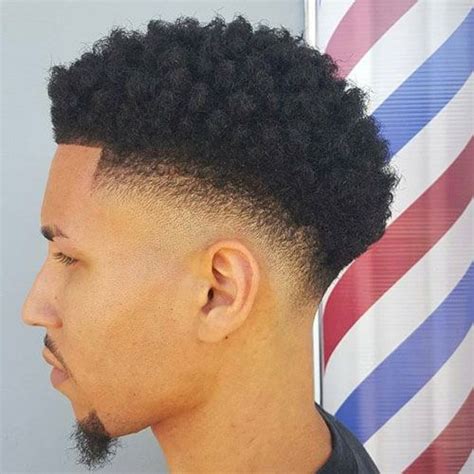 1. Mohawk with Low Fade. This low fade afro is very relaxed & fun-looking, appropriate for black men who are in their mid-twenties. If you already have tightly coiled curls make sure you embrace them by adding a bit …. 