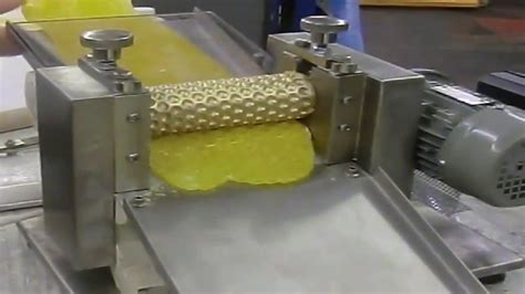 May 19, 2016 · The candy is made by first heating up a sugar mixture, then slowly cooling it. Once it has reached a consistent workable temperature, the molten candy is fed through the rollers. As it is thinned ... . 