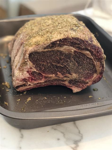 Dry aged prime rib. How To Wet Age Beef. Purchase a large subprimal cut of beef that is sealed in cryovac. Place the beef in a refrigerator set at 35F. Turn the beef over once per week while it is aging. Let the beef age for 45-60 days. Let’s look at each of these steps in more detail. 