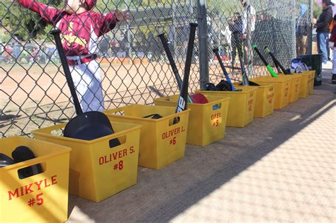 Dugout buckets. These bright, cheerful plastic storage buckets are a stylish way to store balls, gloves, or have for every softball or baseball player in the dugout!Assorted among many colors, each 13.75x12.5-in. bucket is 9.25-in. deep and has convenient built-in carrying handles, making them great for both icing down your drinks at 