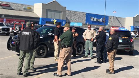 Two men and a woman were shot dead on Monday outside a Walmart store in Oklahoma, the local chief of police said.. One man and the woman were shot inside a car and the second man was in the .... 