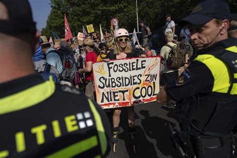 Dutch police cleared out climate protesters blocking a highway over fossil fuel subsidies