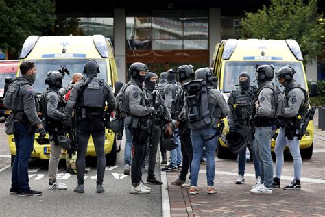 Dutch police say 2 people are killed in shootings at a university hospital and home in Rotterdam