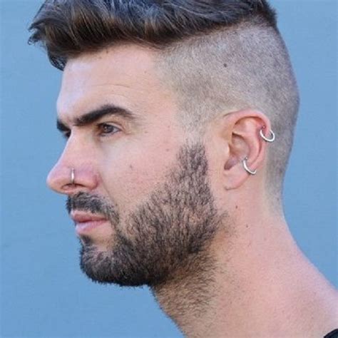 Ear piercing for men. Let’s take a look at a photo gallery of various ear stack examples for men. Solo diamond piercing earring. A diamond ‘solo’ means a single diamond. When the diamond solo earring is small, it looks stylish in combination with other ear piercings (hoops, helix earrings). diamond ear piercing for men 18 carat solid gold lena … 