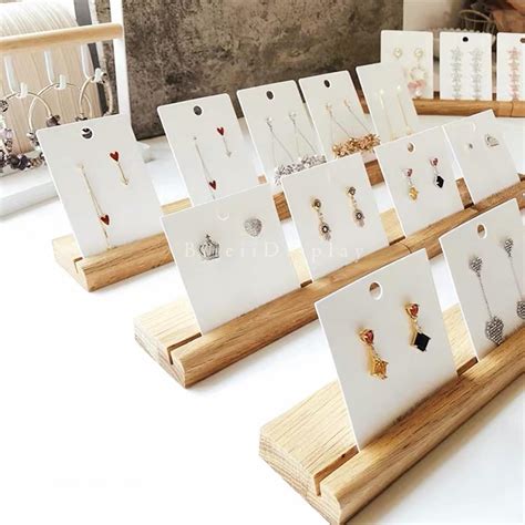 Earring display cards. DGWJSU Earring Display Stands for Selling, Earring Rack Display Holder Stand, Jewelry Display for Selling Earring Cards, Bracelets, Hair Accessories, Rings, Necklaces 39" W x 23" D x 19" H (64 Hooks) 6. $5999. Save $10.00 with coupon. FREE delivery Tue, Feb 27. 