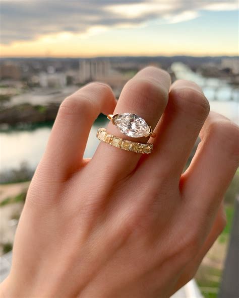 East west engagement ring. The East West Pave Diamond Engagement Ring is set with a high-profile, emerald-cut diamond that really grabs attention. The addition of 0.16 carats of accent … 