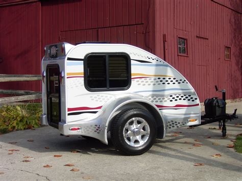 Price: $3,195.00. The Mini Mate camper can be set up to form a sleeping space for two in about two minutes! Though it only has 15 cubic feet of cargo space, it’s only 260 pounds, making for easy motorcycle towing. Other features include: Fiberglass body and lid. U/V and water-resistant tent.. 