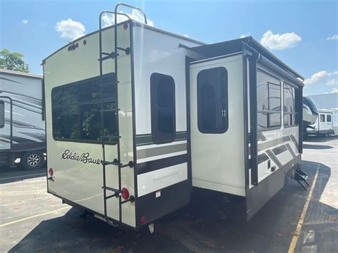 The 2023 Dutchmen Eddie Bauer Signature 310RL is a fantastic choice for families looking for a luxurious and modern fifth wheel. With a cozy interior, this model offers all the amenities you need to.... 