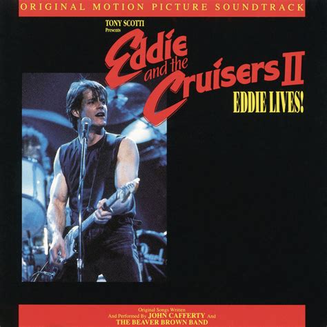 We had to wait 6 years until we got handed a sequel in the form of “Eddie and the Cruisers II: Eddie Lives!”. By title alone, we pretty much get the point of this release…. Eddie never died. But then again, we knew that from the finale of the first film what was going on. Eddie grew a mustache, took on a construction job, and somehow was ...