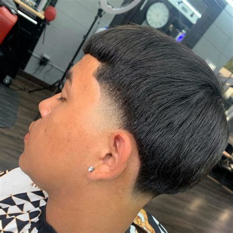 Edgar cut fade. Versatile. The Edgar haircut fade features short and tapered sides, gradually transitioning to longer hair on top. It creates a strong contrast that accentuates the texture and volume of the fluffy Edgar cut. An advantage of the Edgar cut fade is its low-maintenance nature. 