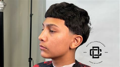 Edgar low taper fade. A curly taper fade is a great choice because it gives the hair structure and will create a contrast with the fullness of the hair on top. 13. Edgar with Line-up and Skin Fade. The Edgar haircut is similar to the Caesar cut in style, with the hair cut around the same length all around. 