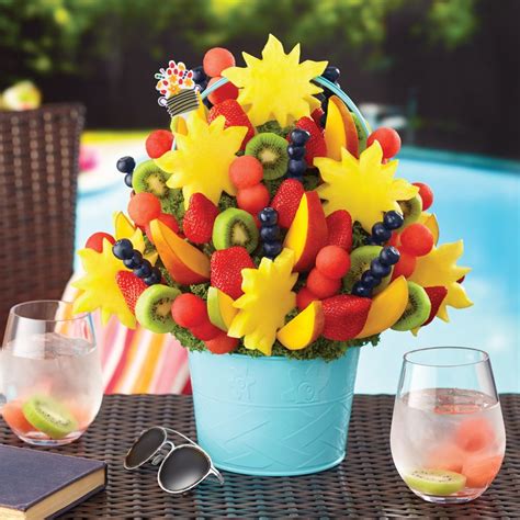Artfully arranged in a colorful container, this fruit bouquet features delectable chocolate covered strawberries dipped in gourmet, semisweet chocolate with brightly-colored Swizzle®, succulent pineapple daisies, pineapple butterflies, and pineapple hearts. As if that weren't enough, fresh honeydew, and delicious cantaloupe, combine to .... 