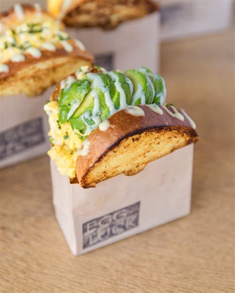 Eggtuck - DOWNTOWN — Nicole Kim knew she wanted to bring Egg Tuck’s sandwiches from Los Angeles to Chicago from the very first bite she had of one. Now, the viral southern California Korean egg sandwich — which won the title of Best Eggs in LA Weekly — is coming to three locations in the city. Its first, 326 N. …