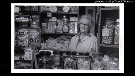 Elderly Woman Behind the Counter in a Small Town - KaraFun