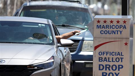 Election officials: Armed "vigilantes" near ballot drop box in Arizona