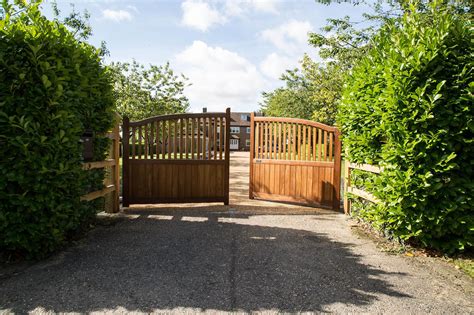 Electric driveway gates. Windlesham Electric Gates manufactures and installs stunning electric gates and automatic gates, meeting the highest quality standards here in the UK. We offer a range of material types to exquisitely craft your electric gate ranging from wood to metal and aluminium. We install swing, sliding, bi-parting, and cantilever-style gates that are ... 